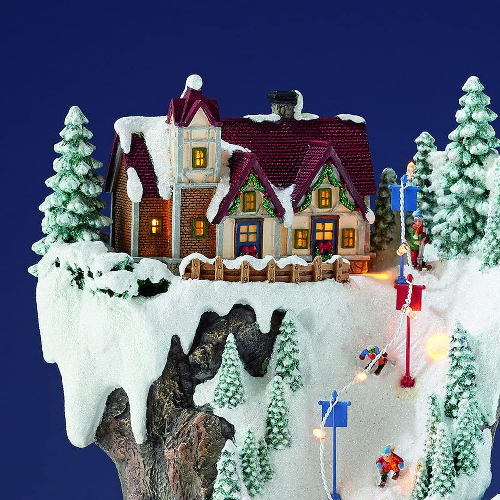 MOMENTS IN TIME 20.5“H Ski Resort Mountain Resin Christmas Village Buildings, Featuring LED Lights, Christmas Music, and Animated Train - Power Adapter (Included)