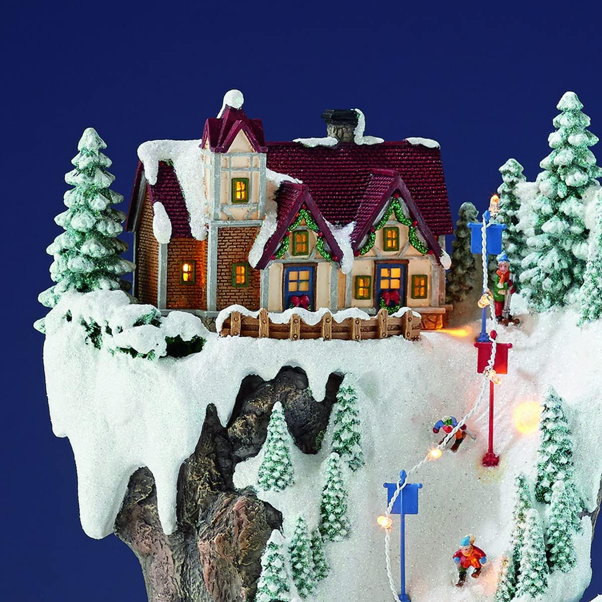 MOMENTS IN TIME 20.5“H Ski Resort Mountain Resin Christmas Village Buildings, Featuring LED Lights, Christmas Music, and Animated Train - Power Adapter (Included)