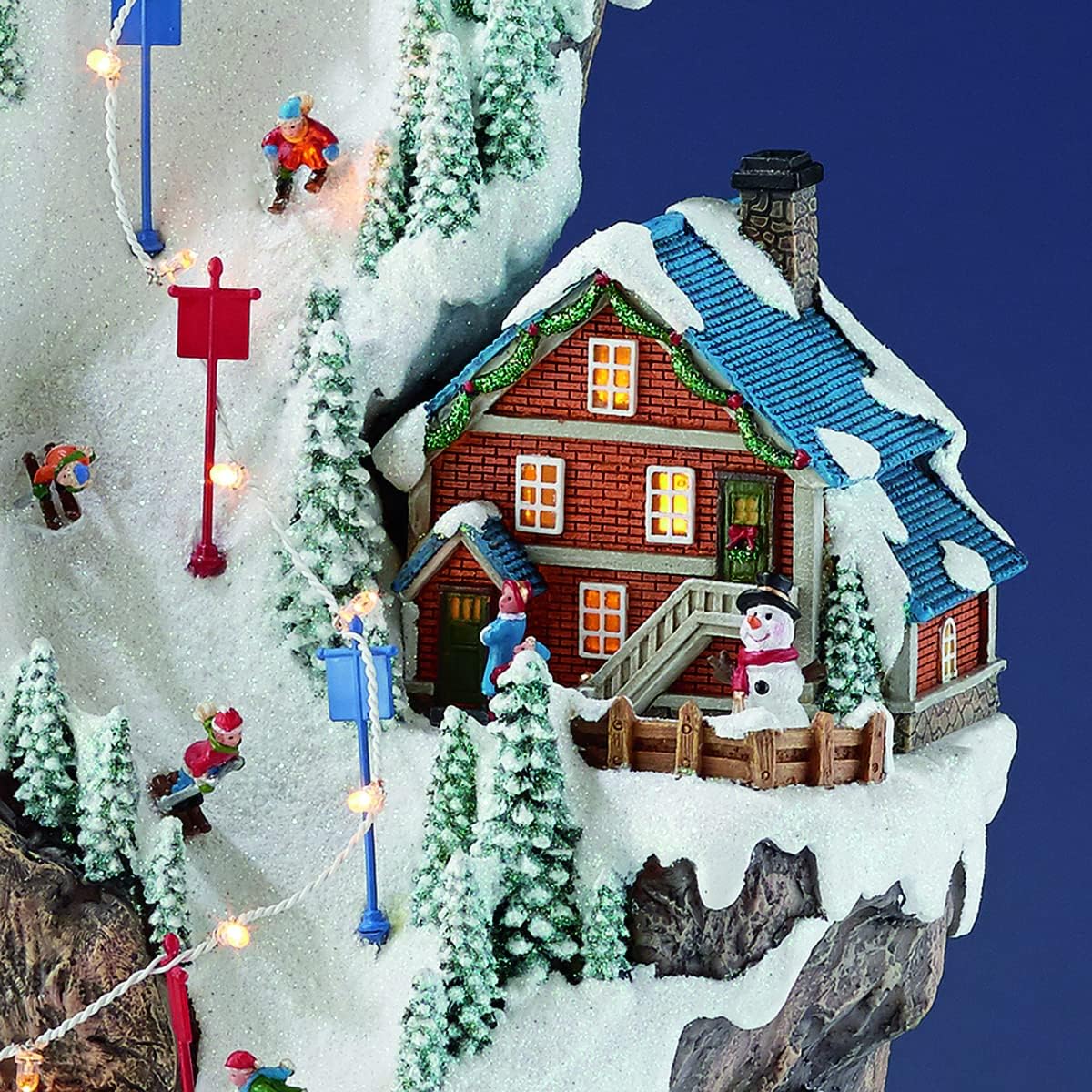 MOMENTS IN TIME 20.5“H Ski Resort Mountain Resin Christmas Village Buildings, Featuring LED Lights, Christmas Music, and Animated Train - Power Adapter (Included)