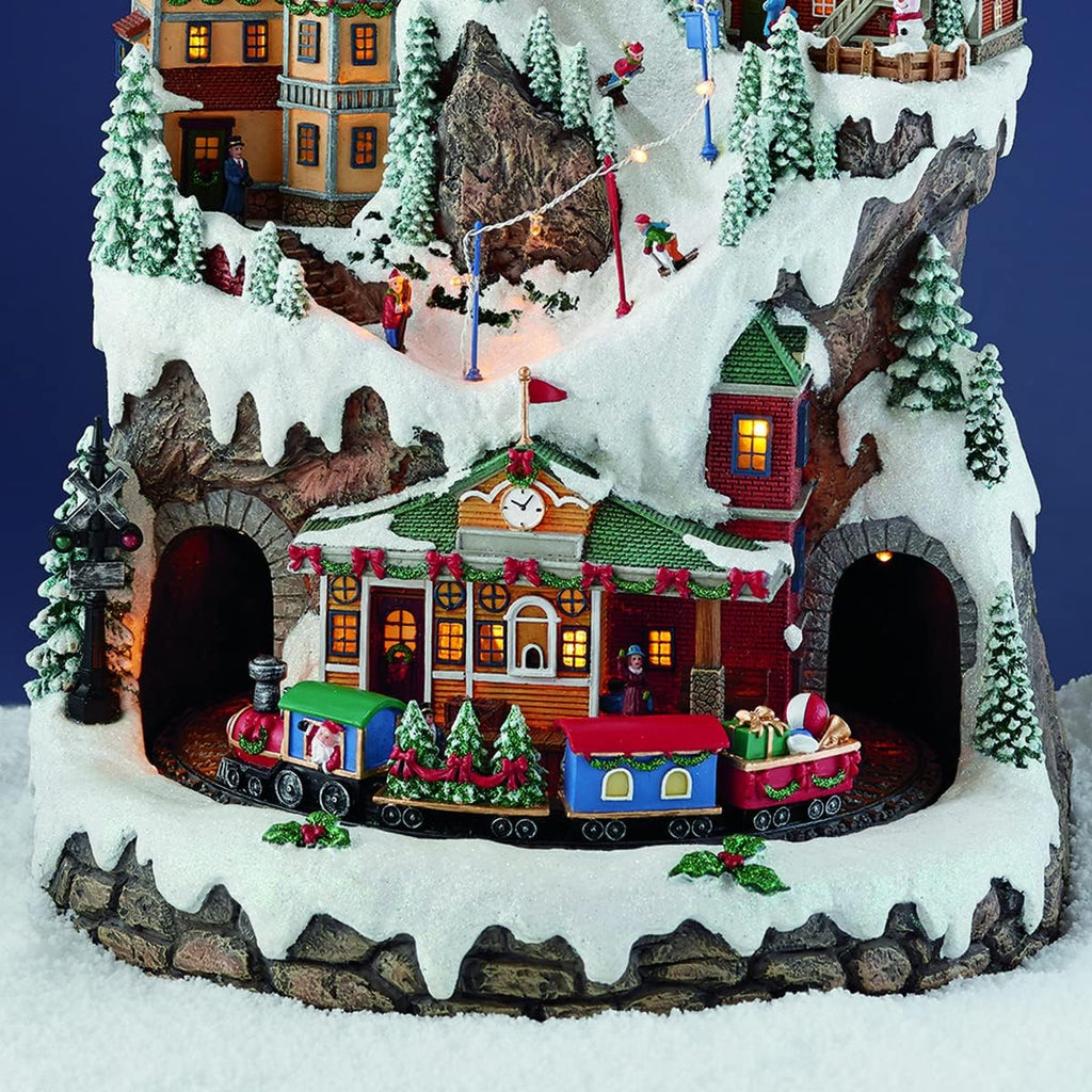 MOMENTS IN TIME 20.5“H Ski Resort Mountain Resin Christmas Village Buildings, Featuring LED Lights, Christmas Music, and Animated Train - Power Adapter (Included)